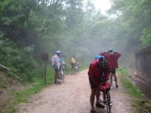 Bikers exiting the abandoned train tunnel on the Sparta Elroy bike trail